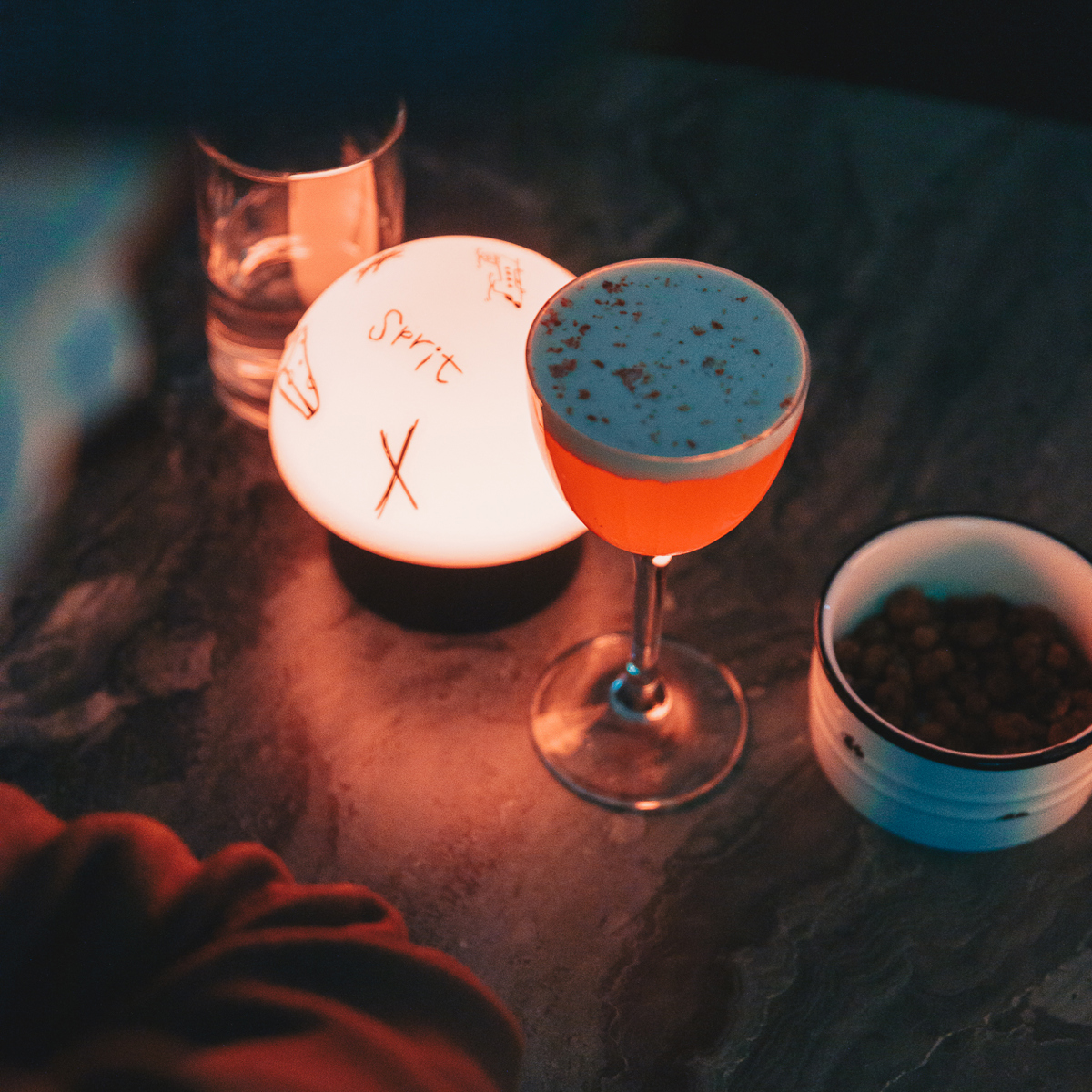 Drinks in the light of a table lamp. 